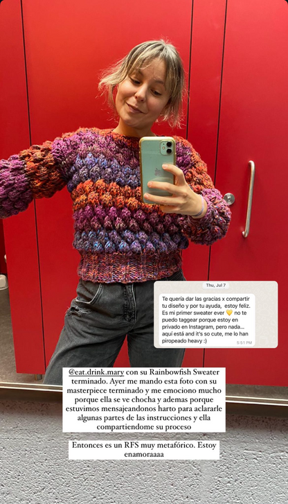 Person wearing a colorful sweater taking a mirror selfie with a red background